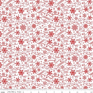 May include: Red snowflake and swirl pattern on a white background. The pattern is repeated throughout the fabric.