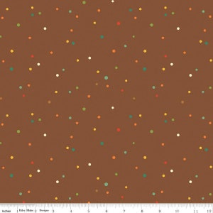 May include: Brown fabric with a repeating pattern of small, colorful dots and hexagons.