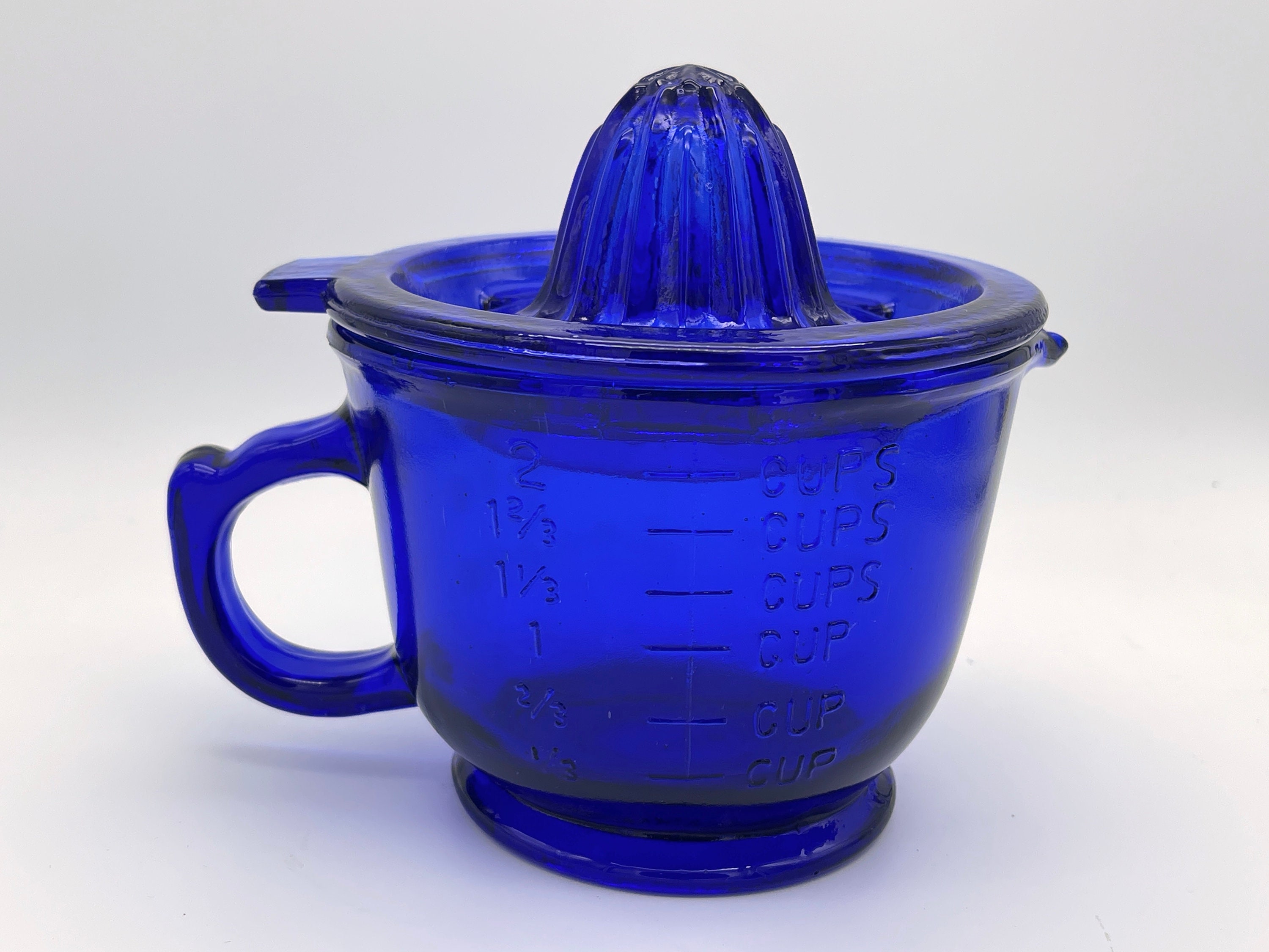 Confusing Measuring Cup with Reamer in Blue Glass