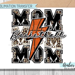 May include: Sublimation transfer design featuring the word "MOM" in black letters with a leopard print background. A basketball with a lightning bolt design is in the center with the text "Basketball Mom" underneath.