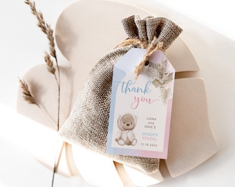 May include: Thank you favour bag with a light blue and pink tag featuring a watercolour illustration of a teddy bear wearing a white coat. The tag also includes the text "Thank you", "Liana and Dave's Gender Reveal", and "12.18.202X".