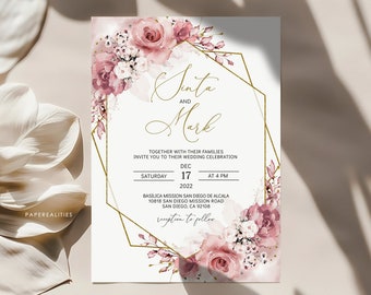 May include: A wedding invitation with a gold geometric frame and pink floral accents. The invitation reads "Sita and Mark" with the wedding date and time: "Saturday, December 17, 2022 at 4 PM". The location is listed as "Basilica Mission San Diego de Alcala, 10818 San Diego Mission Road, San Diego, CA 92108".