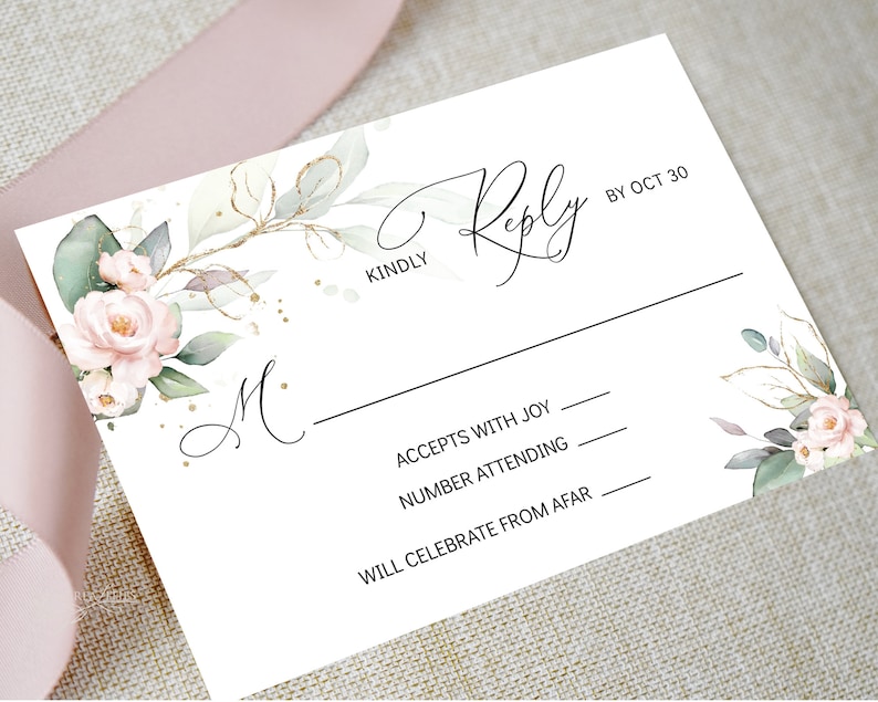 May include: A white RSVP card with a floral design featuring pink roses and green leaves. The card has a black line and the text "KINDLY Reply BY OCT 30". The card also has the text "ACCEPTS WITH JOY", "NUMBER ATTENDING", and "WILL CELEBRATE FROM AFAR" with lines for writing.