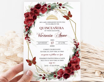 May include: A Quinceañera invitation with a gold geometric frame and red floral accents. The invitation features a gold crown, butterflies, and the text "MR. & MRS. HERNÁNDEZ INVITE YOU TO CELEBRATE THE QUINCEAÑERA OF THEIR DAUGHTER Victoria Anne DEC 17 AT 2 PM 20XX CHRIST CHURCH NYC 524 PARK AVE. NEW YORK, NY 10065 reception to follow at 4pm VENIERO'S PASTICCERIA & CAFFE 342 E 11TH ST. NEW YORK, NY 10003 RSVP to: KATE - 111 222 333 444".