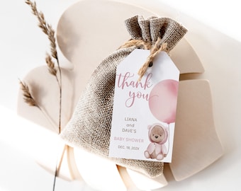 May include: Thank you tag with a pink watercolor balloon and a teddy bear wearing a pink hooded sweater. The tag says "Thank you" in pink script and "Liana and Dave's Baby Shower Dec. 18, 202X".