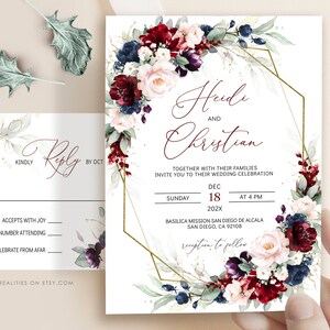 May include: Wedding invitation with a burgundy, blush, and navy floral design. The invitation features a gold geometric frame and the text "Heidi and Christian" with the wedding date and location.