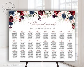 May include: A wedding seating chart with a floral design featuring burgundy, blush pink, and navy blue flowers. The chart lists the names of guests assigned to each table number. The text at the top reads "Please find your seat" and "Casey & Elliot | December 17, 202X".