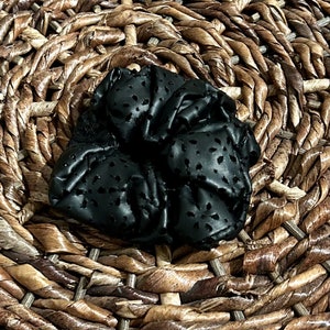 Black faux leather scrunchie with cute flower cutouts