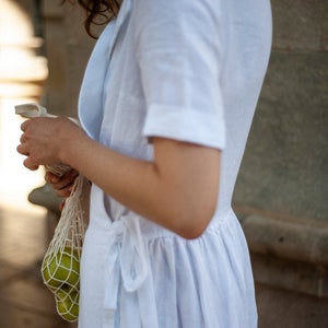 White wrap dress with gathered waist