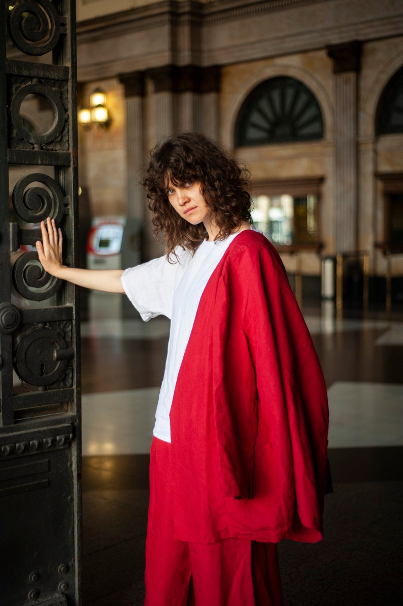 Red linen blazer paired with a plain white linen top