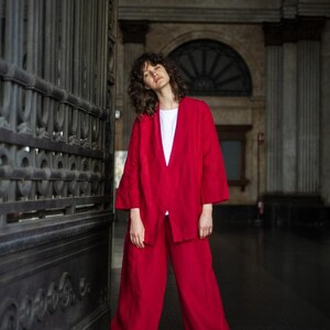 Elegant linen two-piece set of palazzo pants and wide sleeve linen blazer boasting spacious front pockets