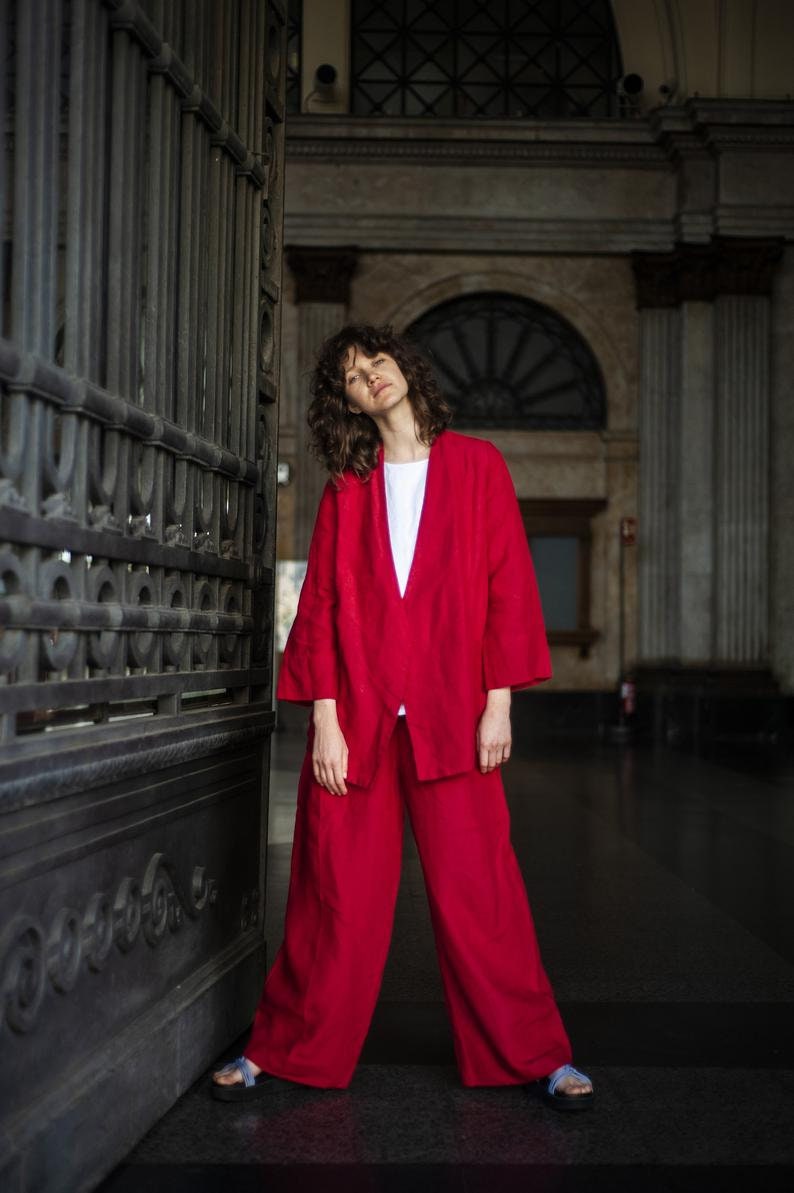 Elegant linen two-piece set of palazzo pants and wide sleeve linen blazer boasting spacious front pockets