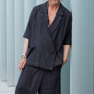 Loose-fit linen blazer with notched lapels paired with linen palazzo pants