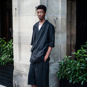 A duo of a black linen blazer and matching shorts