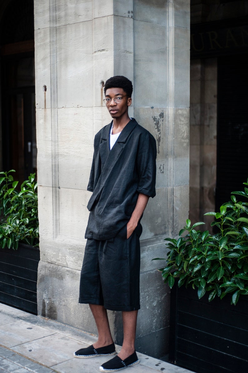 A duo of a black linen blazer and matching shorts