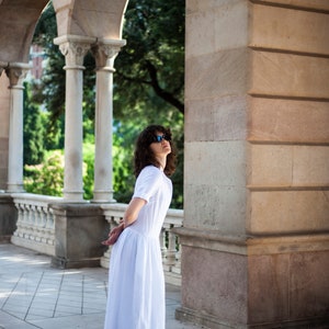 Mid-length linen dress with bust darts and a gathered waistline