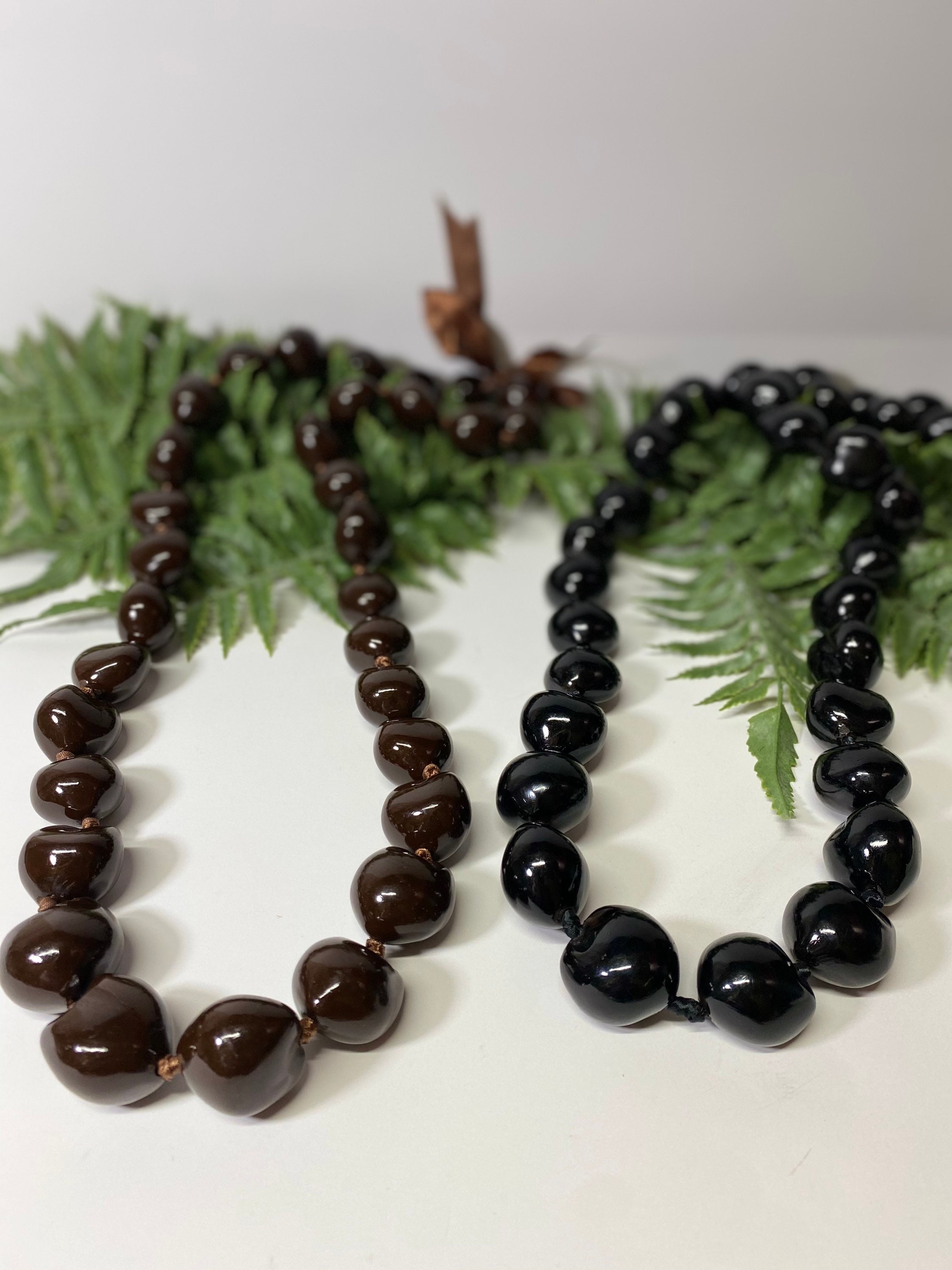 Hawaii Black Kukui Nut Leis with Flower Necklace 30 Inches (Black with  Purple flower) - Walmart.com