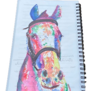May include: A colourful watercolour painting of a horse's head with a black bridle. The horse's coat is painted in shades of pink, blue, yellow, and green. The background is white.