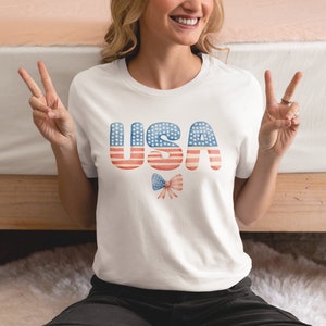 Coquette USA 4th of July Comfort Colors Shirt, American Flag White Bow Tee, Retro Girly Patriotic Women&#39;s Shirt, Cute Independence Day Top