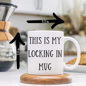 May include: White ceramic mug with black text that reads "This is my locking in mug". The mug is 3.6 inches tall and 3.2 inches wide.