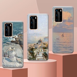 May include: Three phone cases with different scenic paintings. The first case features a seascape with a woman in a hat sitting on a rocky shore. The second case shows a cityscape with a church and buildings. The third case depicts a seascape with a sailboat in the distance.