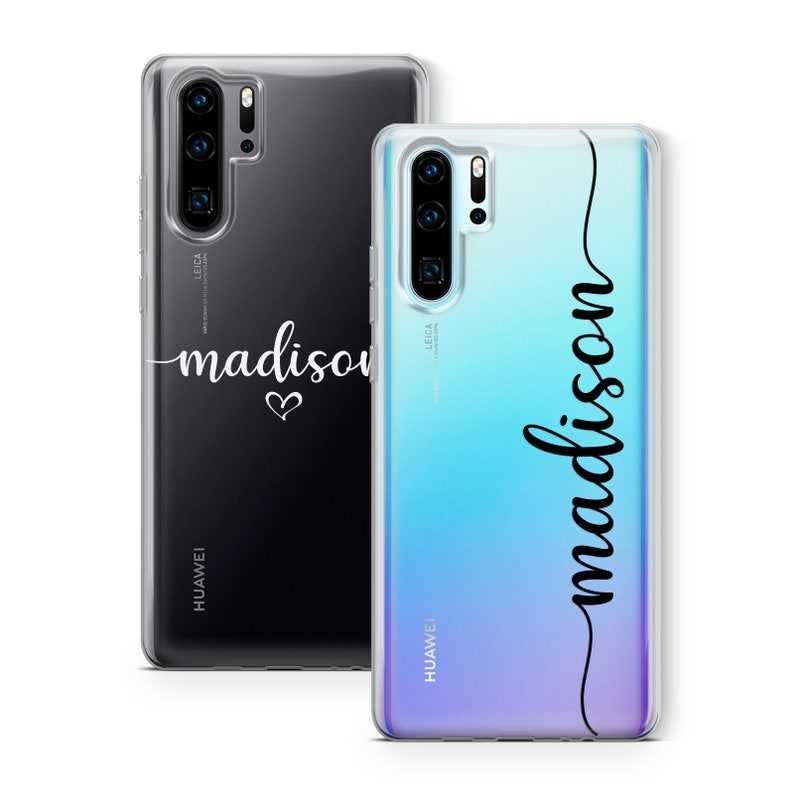 May include: Two clear phone cases with the name "madison" printed on them. One case is black with a white script font and a heart. The other case has a gradient blue and purple background with the name "madison" in a black script font.