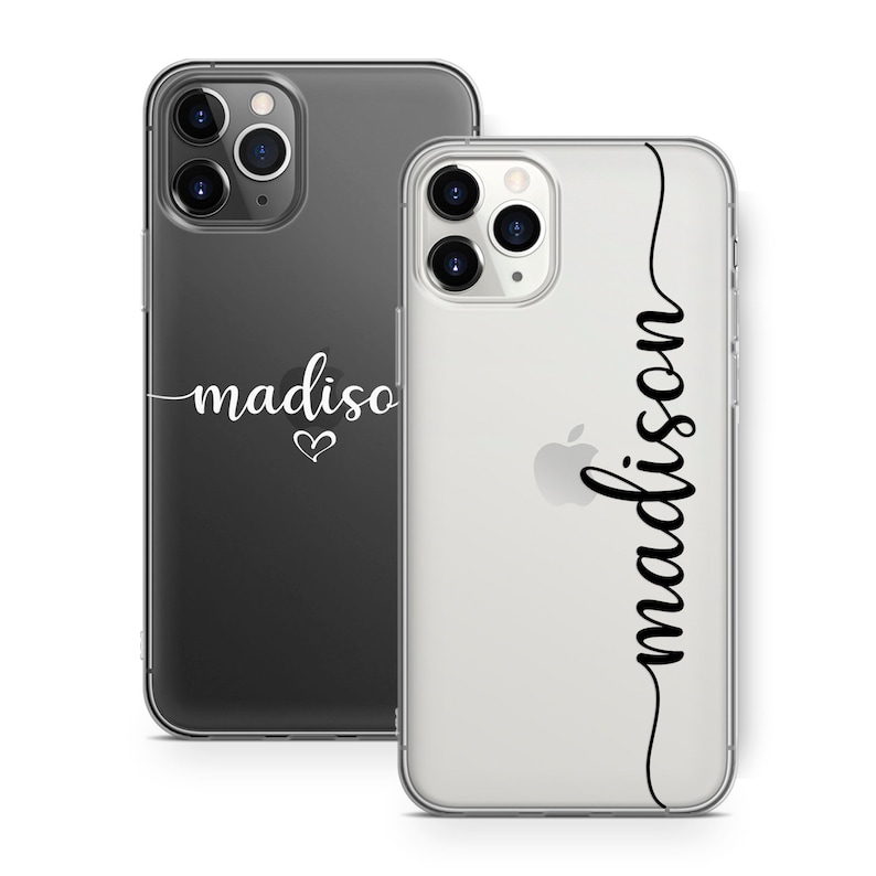 May include: Two phone cases, one black and one clear, with the name "madison" in cursive script. The black case has a heart symbol below the name. The clear case has the name "madison" vertically along the side.