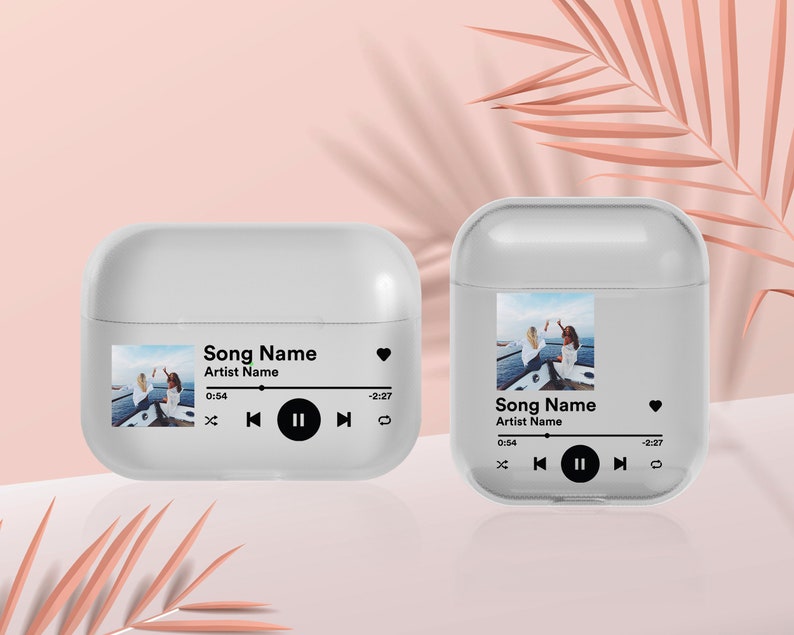 May include: White phone case with a photo of two people on a boat and a music player interface with the text "Song Name" and "Artist Name".