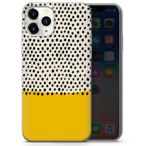 May include: A clear phone case with a white background and black polka dots. The bottom half of the case is yellow.