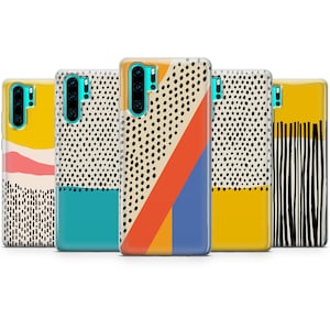May include: Five different phone cases with abstract geometric designs. The cases are all black and white with pops of color, including yellow, orange, blue, and turquoise.