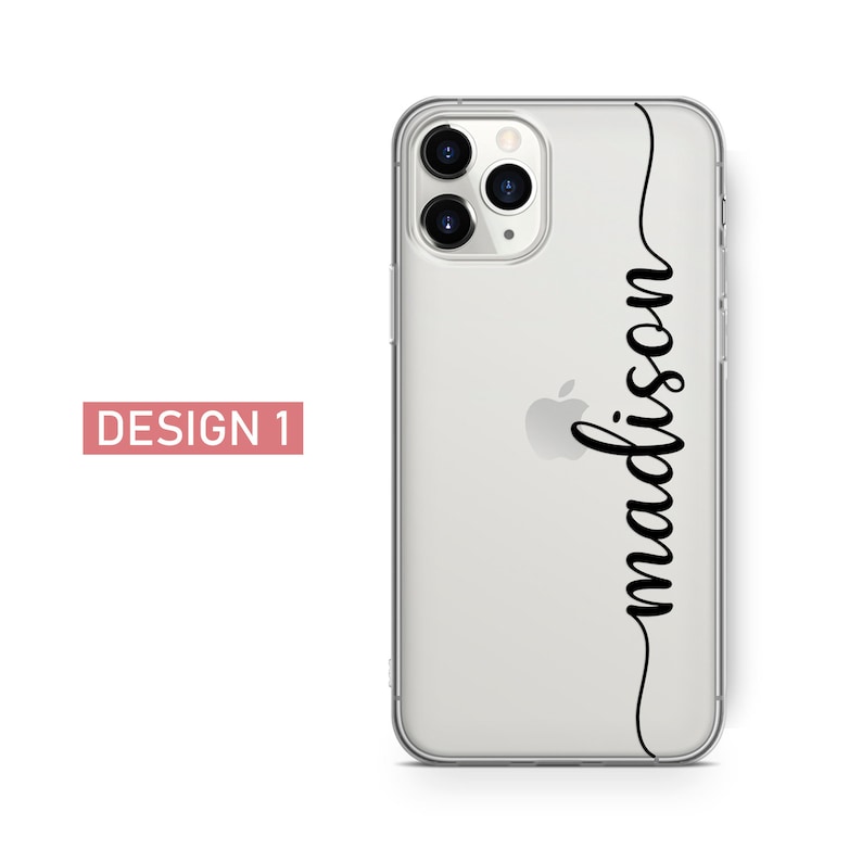 May include: Clear phone case with the name "madison" in black script. The phone case is on a white background. The words "DESIGN 1" are in a pink rectangle in the lower left corner.
