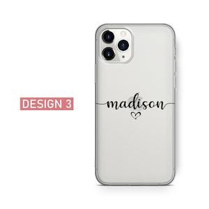 May include: Clear phone case with the name "madison" in black script, with a small heart below the name. The words "DESIGN 3" are in a pink rectangle in the upper left corner.