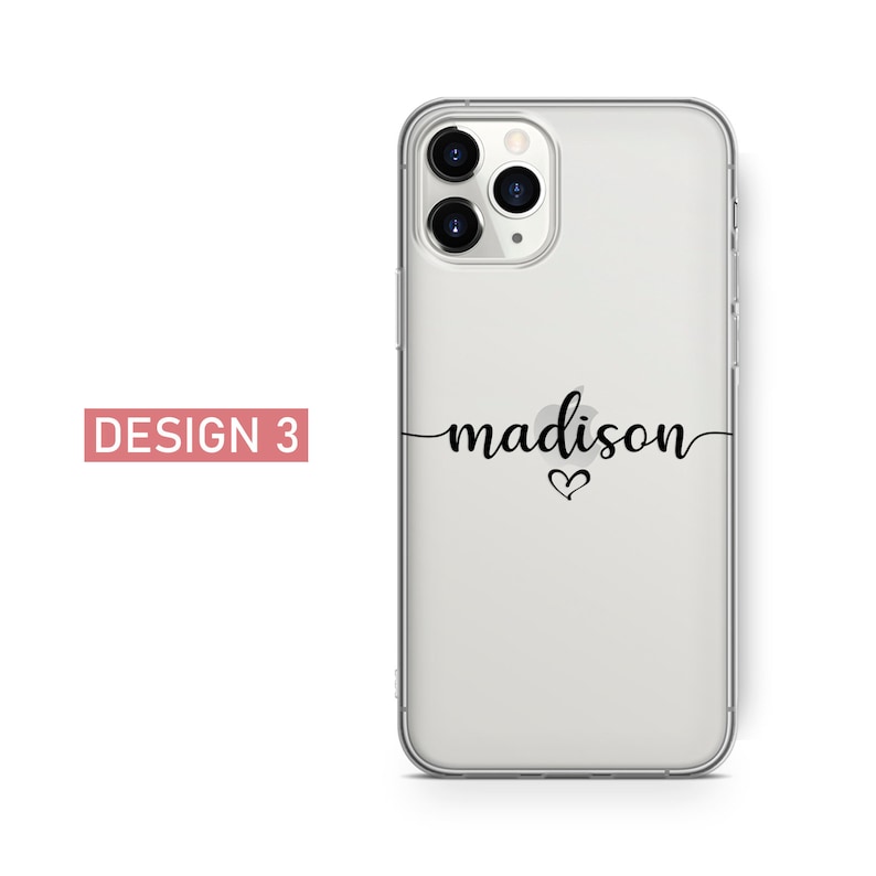 May include: Clear phone case with the name "madison" in black script, with a small heart below the name. The words "DESIGN 3" are in a pink rectangle in the upper left corner.