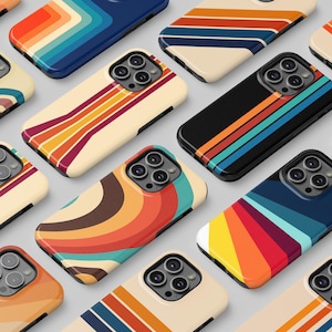 May include: A collection of smartphone cases featuring various retro-inspired striped and wavy patterns in vibrant colour palettes including orange, yellow, blue, red, and cream. Each case has a prominent camera cutout with multiple lens openings.