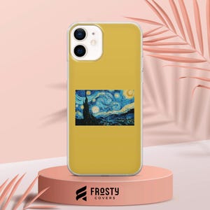 May include: A mustard yellow smartphone case featuring a rectangular print of Vincent van Gogh's The Starry Night painting. The case has a dual-camera cutout at the top left and a smooth, solid-colored finish surrounding the central artwork.