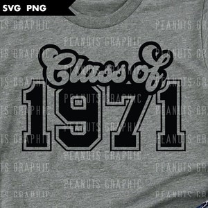 May include: A gray t-shirt featuring the text "Class of 1971" in a black, bold font. The design includes the year 1971 in a large, blocky style, with the words "Class of" above it in a script font. The shirt has a classic crew neck.