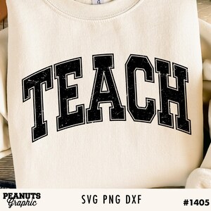 May include: A white sweatshirt with the word "TEACH" in black block letters with a distressed look. The letters are arched and have a thick outline.