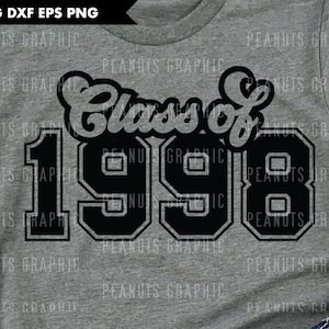 May include: Gray t-shirt with the text "Class of 1998" in a black, collegiate-style font. The numbers are bold and outlined. The shirt is a casual style, suitable for graduation or a reunion.