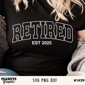 May include: Black t-shirt with white text that reads "Retired Est 2025".