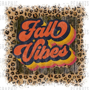 May include: A distressed, vintage-style graphic with a leopard print background. The graphic features the text "Fall Vibes" in a retro font with orange, yellow, and red colors.