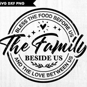 May include: Black and white circular design with the text "Bless the food before us the family beside us and the love between us".