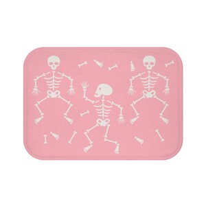 Dancing skeletons - Pink pastel goth bath mat | Fun pastel goth decor bath rug | Unique, cute, witchy, halloween, spooky bathroom mat