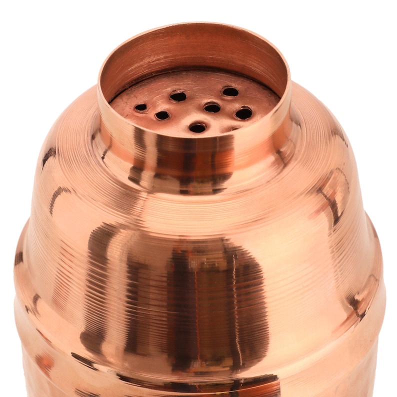 May include: A copper cocktail shaker with a lid that has a series of small holes for straining.