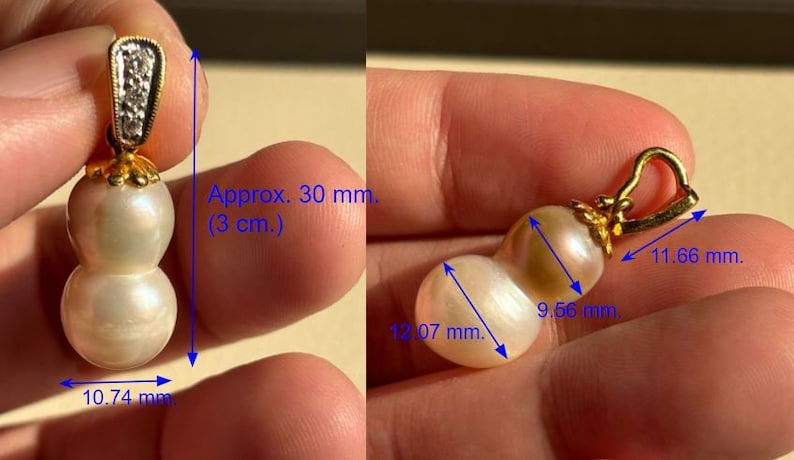 May include: A gold pendant with a double pearl drop. The pearls are white and iridescent. The pendant is approximately 30 mm (1.2 inches) long. The pearls are 12.07 mm, 9.56 mm, and 10.74 mm in diameter.