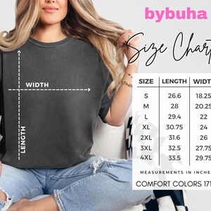 May include: A dark gray t-shirt with a size chart, including measurements in inches. The chart lists sizes S to 4XL, with corresponding length and width measurements. The brand name "bybuha" is visible.