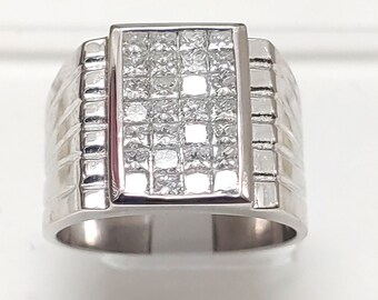 May include: A silver men's ring with a rectangular center piece set with small, clear diamonds.