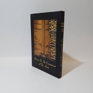 May include: A black book with a gold cover featuring a photo of the Kaaba in Mecca. The title of the book is "Duas For The Contentment of The Heart".