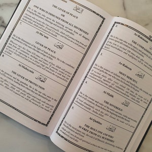 May include: A page from a book with a white background and black text. The text is in Arabic and English. The page is titled "The Giver of Peace" and "The Compassionate".