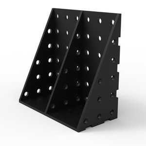 May include: Black, angled storage unit with multiple circular holes. The unit is divided into three sections and appears to be made of a solid material. The design is geometric and modern, suitable for organizing items.