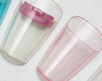 May include: A set of ten clear plastic cups with colored inserts. The cups are arranged in a semi-circle, with the colors of the inserts ranging from black to purple to yellow.